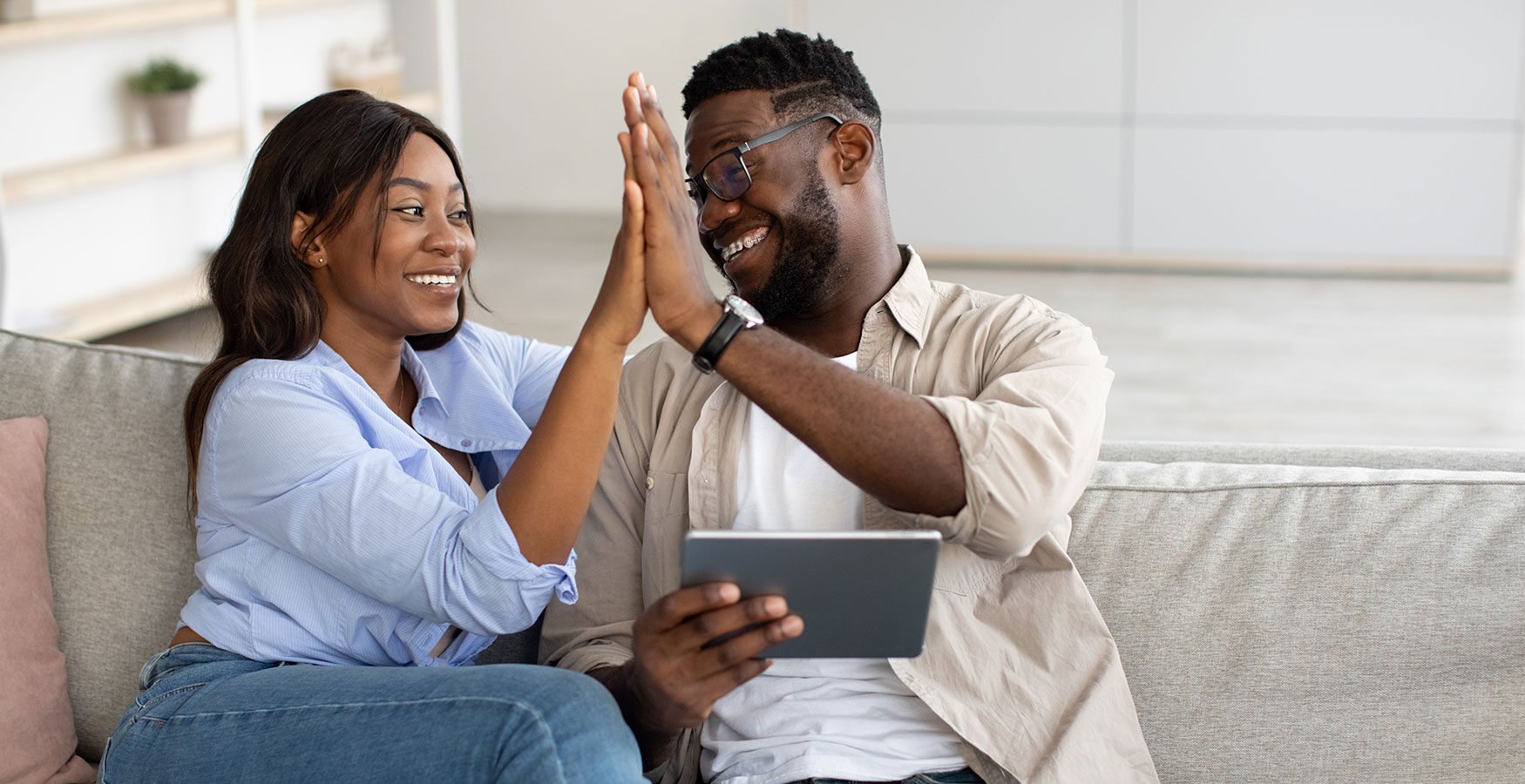 Couple highfiving 