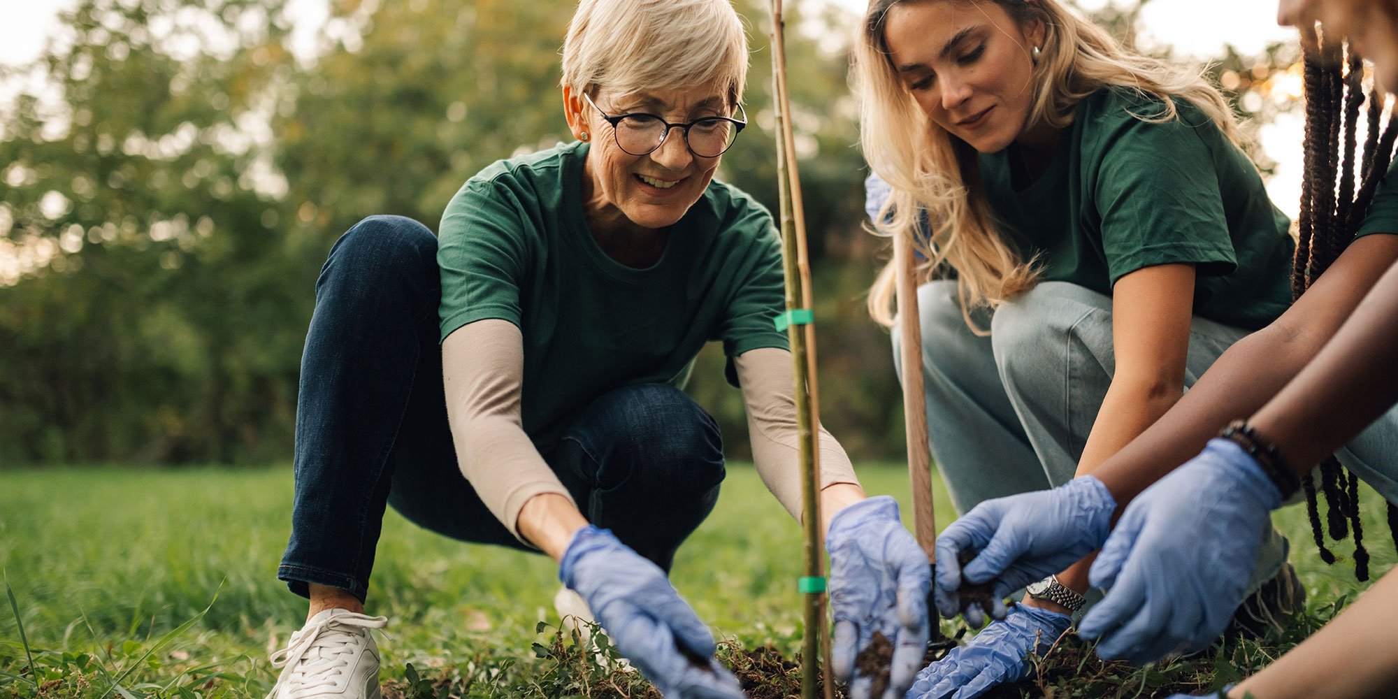 two women planting a tree