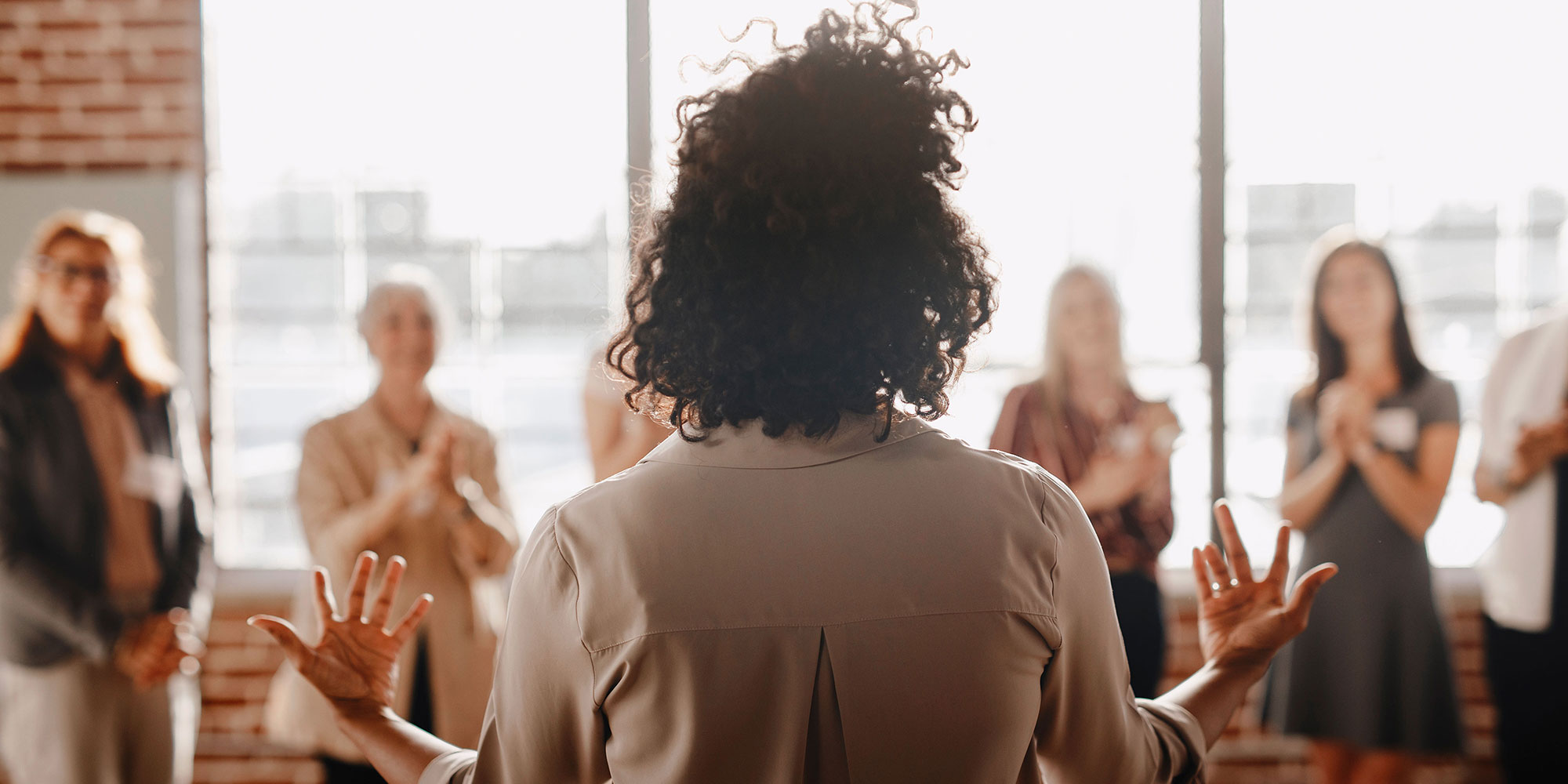 Women leading meeting