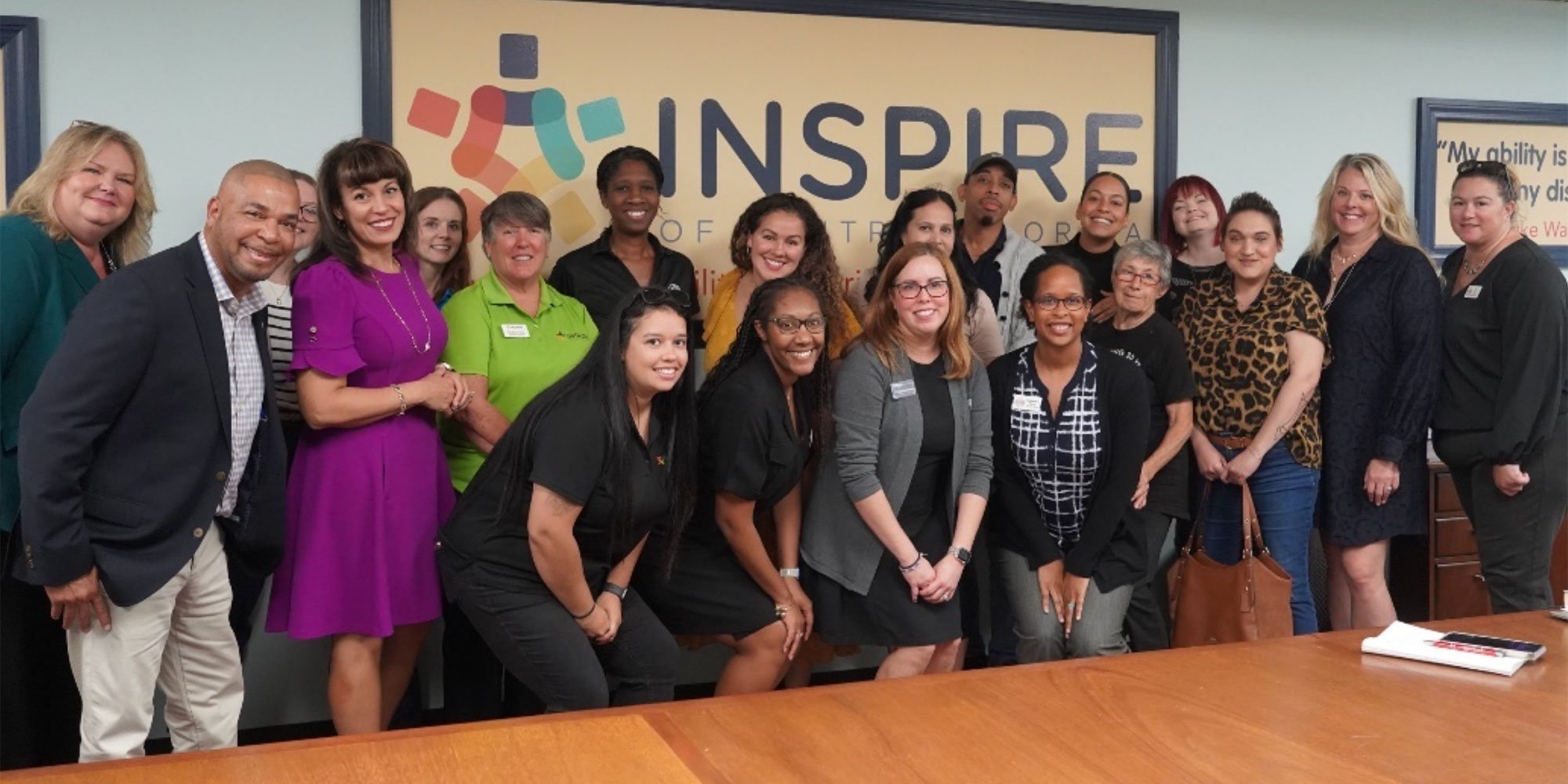 The Addition Financial Foundation posing with the Inspire of Central Florida team.