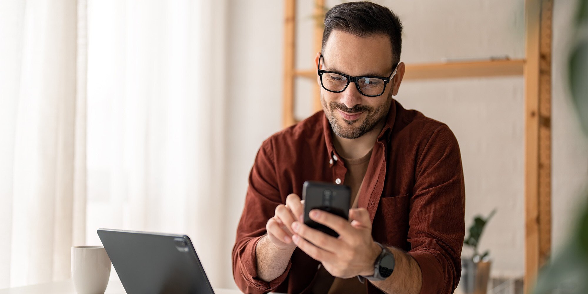 Man scrolling through his phone. 