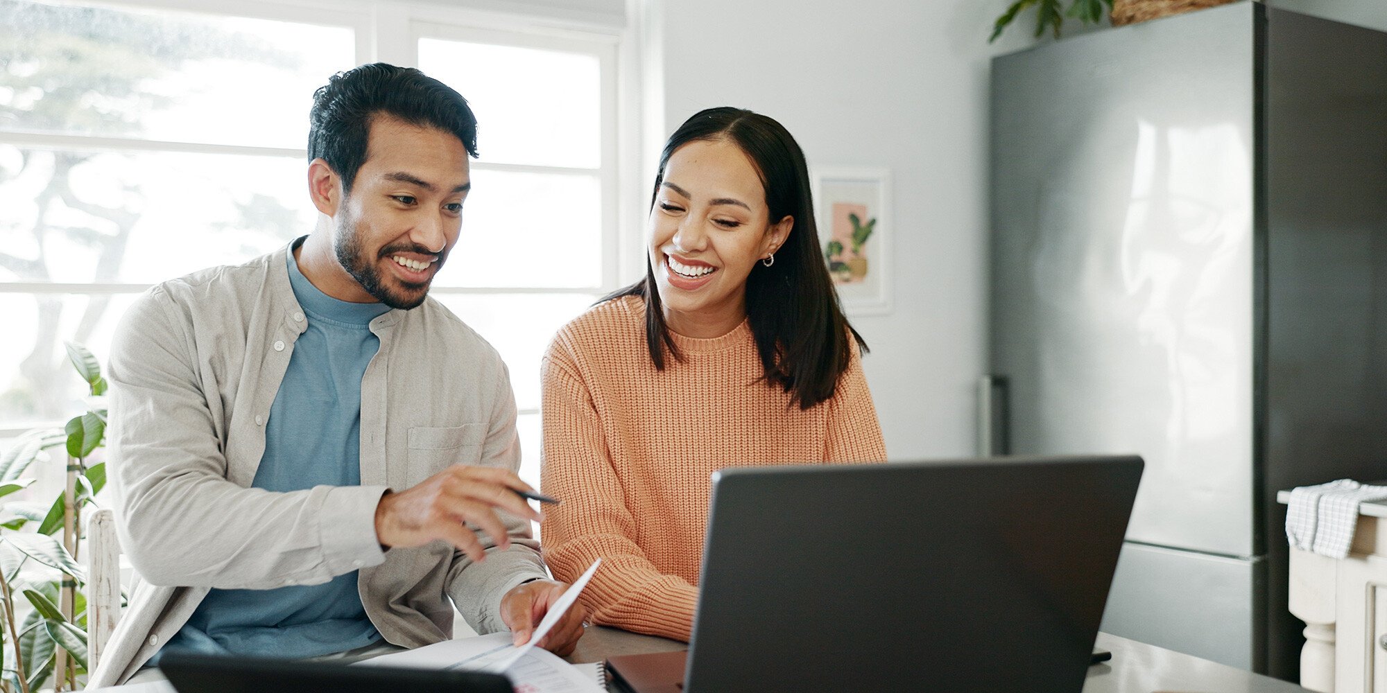 Man and woman looking over their financial goals.