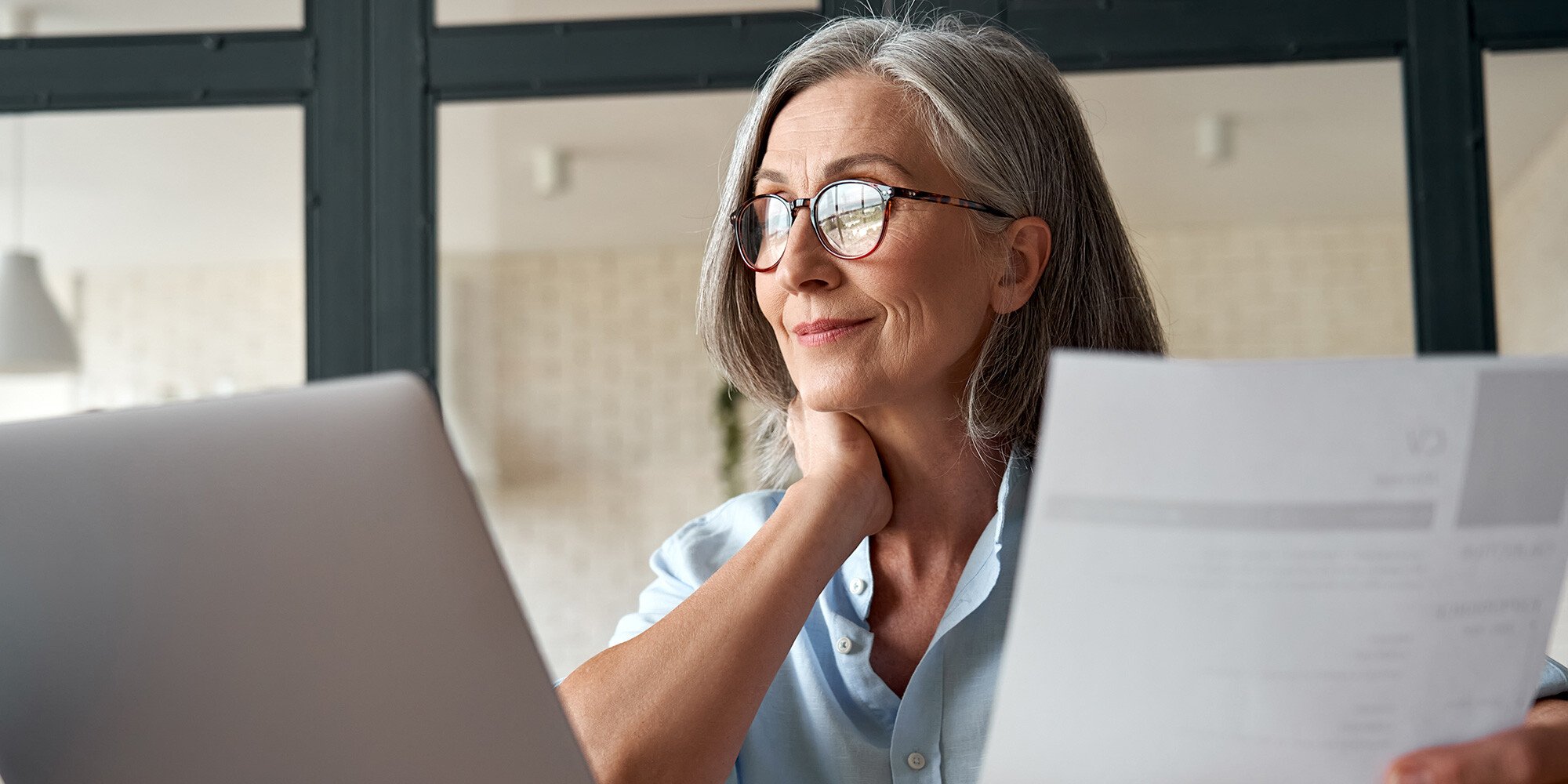 Older woman looking at her computer. 