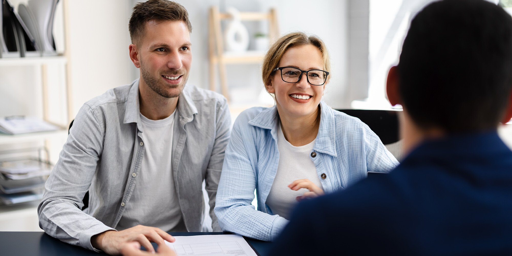 Couple talking to a financial advisor. 